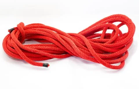 Twisted thick rope on white Stock Photos