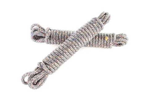 Twisted thick rope on white. Stock Photos