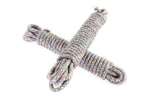 Twisted thick rope on white. Stock Photos