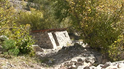 Twisted view of old stone house in the woods, trail and deciduous trees Stock Footage 33421050