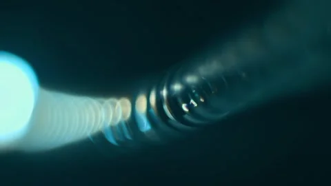 The twisted wire of an old push-button telephone is shinу in the dark Video stock 297813305