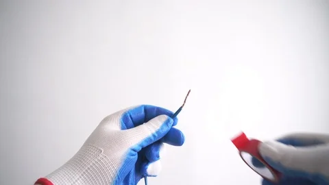 Twisted wire wrapped in red tape. First Person Wire Isolation Stock Footage 121574205
