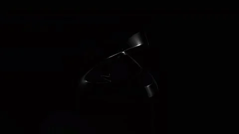 Twisting chrome ribbon rings rotating on black Vídeo Stock 346780305