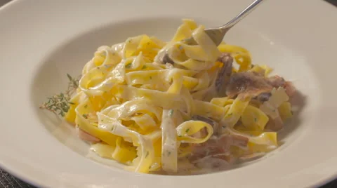 Twisting fork with pasta and taking the  fork away Stock Footage 58575109