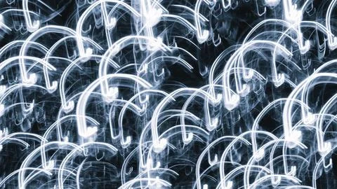 Twisting light trails dance against a deep blue backdrop. Abstract patterns g Stock Photos