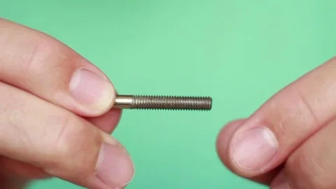 Twisting nut on bolt closeup Vídeo Stock 75629054