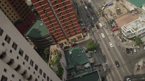 Twisting overhead view of buildings and traffic in downtown Manila Philippines Stock Footage 149336219