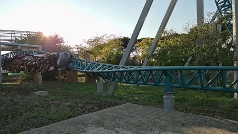 Twisting Roller Coaster Ride in Slow Motion at Theme Park Stock Footage 347768019