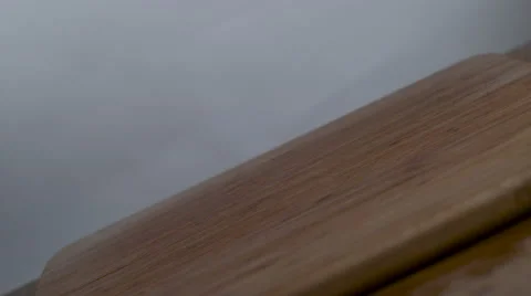 Twisting shot of mixed berries dropped onto a cutting board in slow motion. Stock Footage 64249844