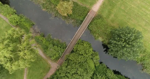 Twisting shot over bridge spanning across river drone aerial 4k Stock Footage 114167799