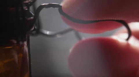 Twisting Top off Craft Beer Bottle. Stock Footage 61840074