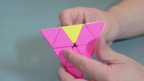 Twisting Triangle Pyramid Speedcube On Desk 스톡 동영상 339124114
