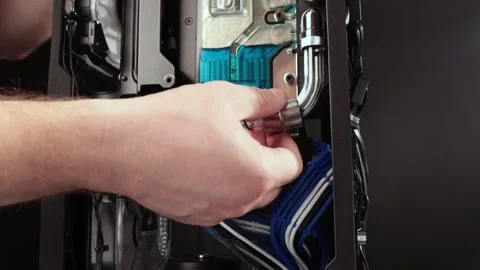 Twisting the tubes for water cooled PC Video stock 133402724