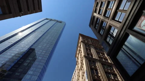 Twisting View Looking Up At Skyscraper Against Blue Sky In Boston Stock-Footage 134197033