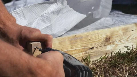 Twists the boards with a screwdriver Stock Footage 314309212