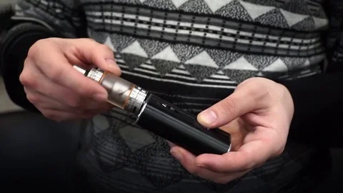 Twists the e-cigarette Stock Footage 74671548