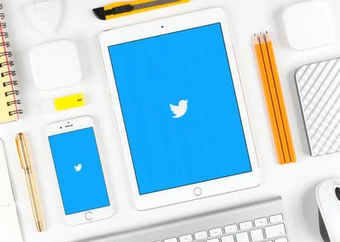 Twitter application on display of iPad and iPhone Stock Photos