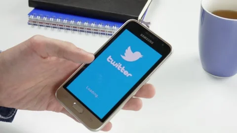 The Twitter application is loaded for a very long time Stock Footage 99835147