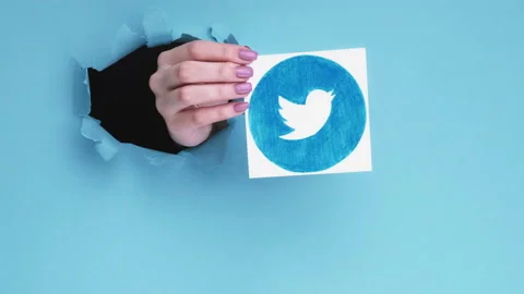 Twitter icon mobile app blogger hand breakthrough Stock Footage 140898504