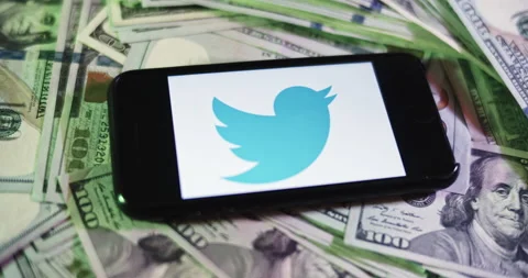 Twitter Logo Image on iphone surrounded by $100 Bills. Stock Footage 169006626