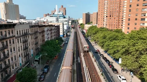 Two 1 trains crossing paths on elevated subway track in Harlem New York City Vidéo 218211483