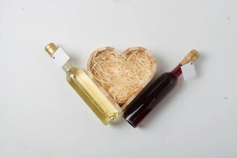 Two 250 ml bottles of red and white wine with blank label on light background Stock Photos