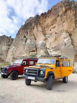 Two 4x4 SUV Parked Side-By-Side Taken From Side Angle At Ortahisar, Turkey 库存照片