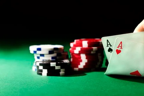 Two aces on green with chips Stock Photos