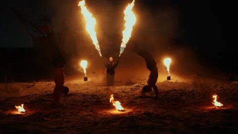 Two Acrobats Men Jumping And Making Flips On And, Enigmatic Fire Performance Stock Footage 253981293