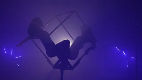 Two Acrobats Performing Tricks Together Inside a Cube Stock Footage 295215755