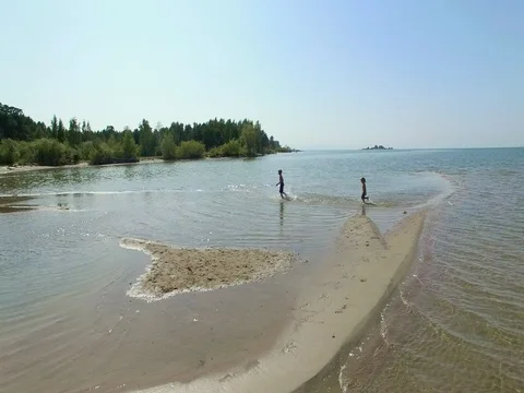 Two active boys running on the beach Stock Footage 80297741