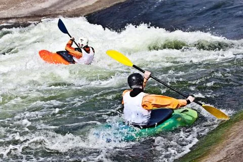 Two active kayakers Stock Photos