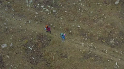Two active tourists with large backpacks and trekking poles Stock-Footage 259793042