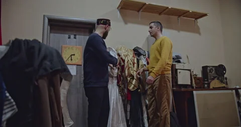 Two Actors Preparing Backstage: Discussing Costumes, Practicing Lines, and Stock Footage 312079709