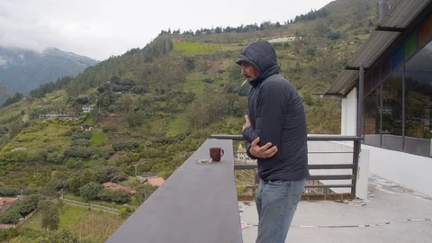 Two adult men with different temperature tolerance meet on a balcony Stock Footage 115349727