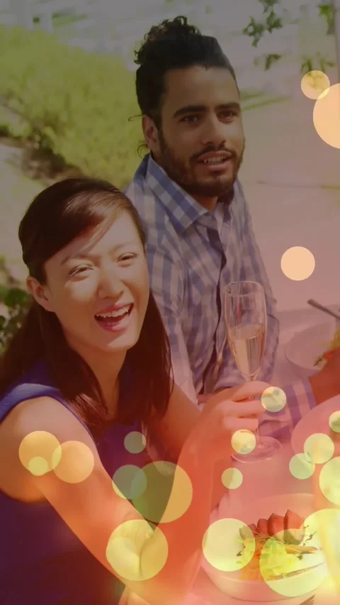 Two adults toasting flutes off-frame hand reaching in bokeh drifting celebrating Stock Footage 334317235