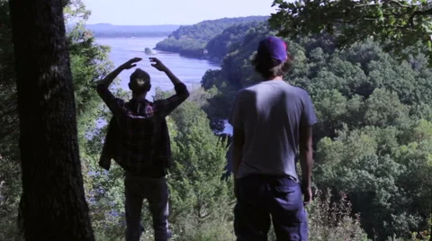 Two Adventurists Walk Into Frame For Pleasant View Of Mississippi River Video stock 41963091