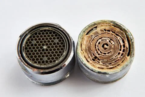 Two aerators dirty with limescale deposits and after cleaning Stock Photos