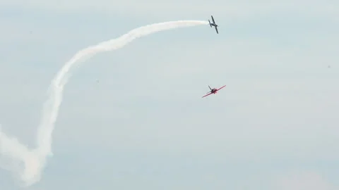 Two Aerobatic Planes Perform Synchronized Loop in Sky Stock Footage 342111193