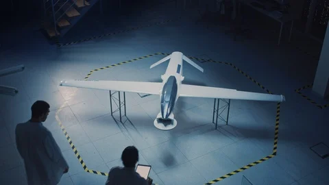 Two Aerospace Engineers Work On Unmanned Aerial Vehicle / Drone Prototype. Stock Footage