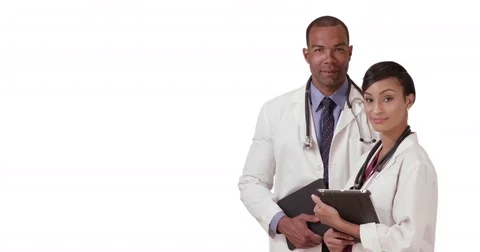 Two African American doctors posing for a portrait while holding their tablets Видео 70405498