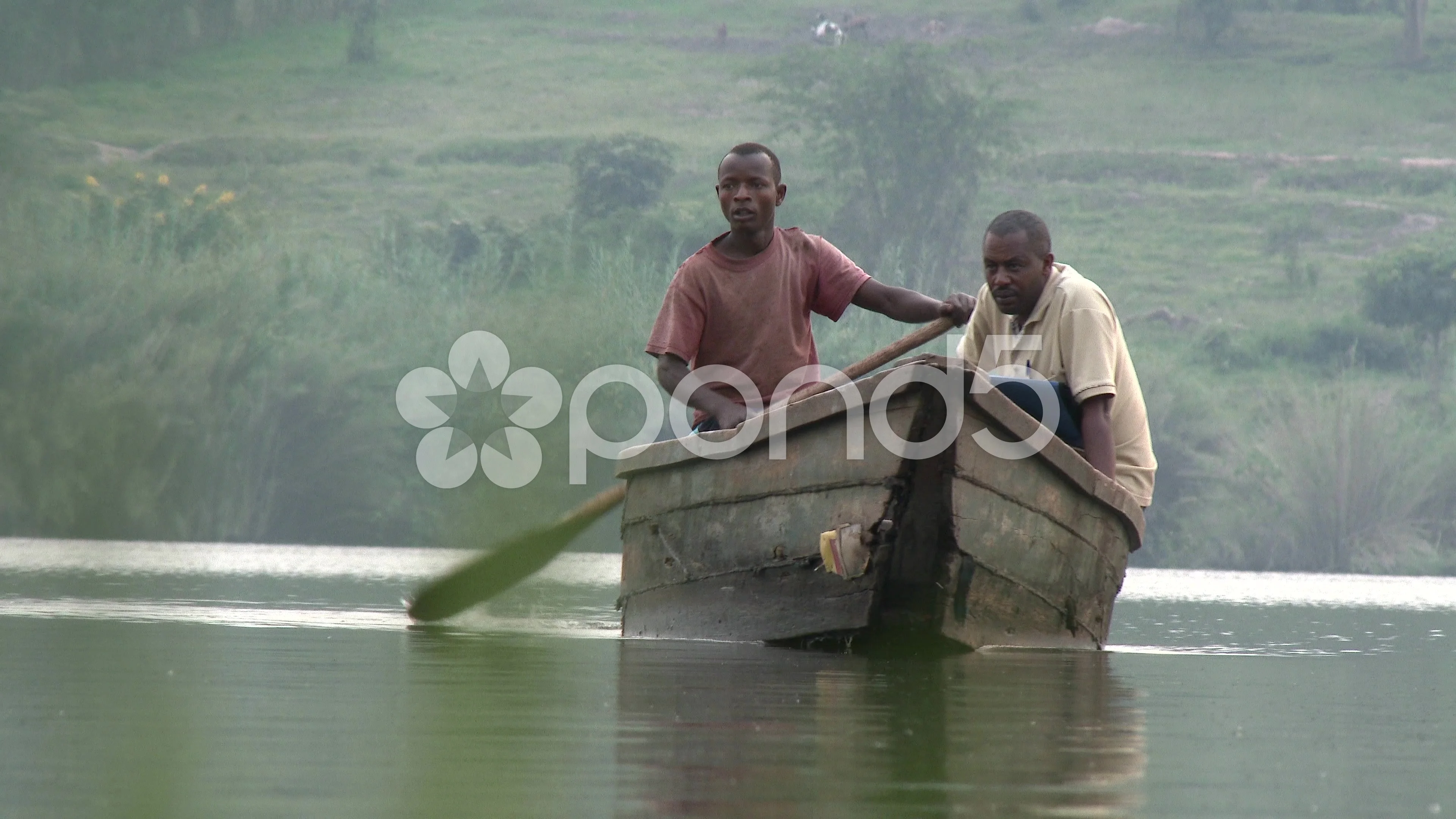 Two African fisherman crossing the river, Stock Video