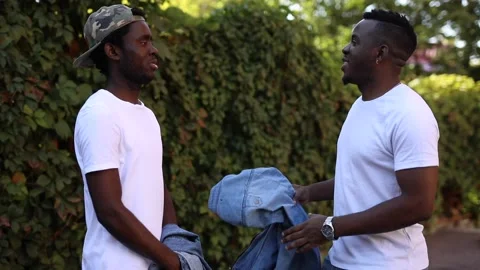 Two African friends communicate with each other Stock Footage 140966245