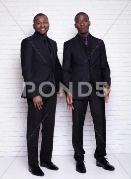 Two african man businessmen in black suit Stock Photos