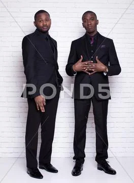 Two african man businessmen in black suit Stock Photos