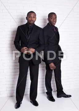 Two african man businessmen in black suit Stock Photos