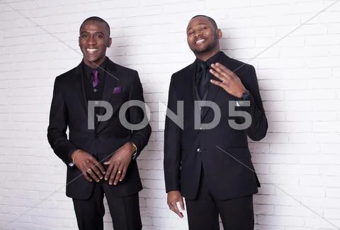 Two african man businessmen in black suit Stock Photos