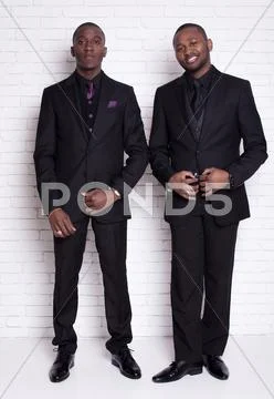 Two african man businessmen in black suit Stock Photos