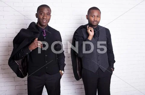 Two african man businessmen in black suit Stock Photos