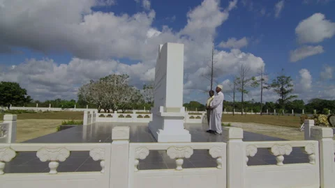 Two African old men lay wreaths at Chinese expert cemetery,   Tanzania  Africa Stock Footage 132430437